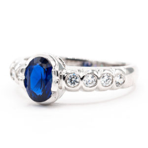10K White Gold Blue Synthetic Stone Ring with Accent Channel Stones